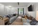 Comfortable living room boasts great natural light, modern furnishings, and relaxing atmosphere at 2444 Mariners Cove Ln, Denver, NC 28037