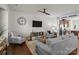 Cozy living area with a ceiling fan, neutral decor, and seamless flow into the adjacent kitchen at 2444 Mariners Cove Ln, Denver, NC 28037