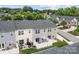 A view of the rear exterior featuring patios with seating, a grill, and a privacy fence at 2444 Mariners Cove Ln, Denver, NC 28037