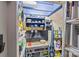 Organized storage area with tools, shelving, and a workbench, ideal for DIY projects and storage at 2444 Mariners Cove Ln, Denver, NC 28037