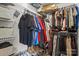 Well-organized walk-in closet featuring shelving, hanging racks, and ample space for clothing and accessories at 2444 Mariners Cove Ln, Denver, NC 28037