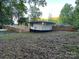 Spacious backyard featuring newly installed fencing, providing privacy and an ample outdoor area at 295 Rendleman Rd, Salisbury, NC 28146