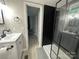 Nicely appointed bathroom featuring a tiled shower with a glass enclosure and modern fixtures at 295 Rendleman Rd, Salisbury, NC 28146