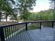 Relaxing deck view overlooking the tranquil lake waters and lush greenery of the surrounding area at 295 Rendleman Rd, Salisbury, NC 28146