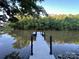 View of a private dock extending into the serene water, perfect for relaxation and recreation at 295 Rendleman Rd, Salisbury, NC 28146