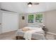 Cozy bedroom with natural light, featuring neutral walls and hardwood-style flooring at 295 Rendleman Rd, Salisbury, NC 28146