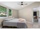 Well-lit bedroom featuring neutral walls, hardwood-style flooring, and access to kitchen area at 295 Rendleman Rd, Salisbury, NC 28146
