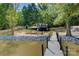 A charming property with waterfront access and a private dock, surrounded by lush greenery at 295 Rendleman Rd, Salisbury, NC 28146
