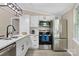 Bright kitchen featuring stainless steel appliances, subway tile backsplash, and modern finishes at 295 Rendleman Rd, Salisbury, NC 28146