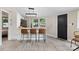 Contemporary kitchen with white cabinetry, stainless appliances, and breakfast bar seating at 295 Rendleman Rd, Salisbury, NC 28146