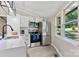Modern kitchen featuring stainless steel appliances, sleek white cabinets, and bright natural light at 295 Rendleman Rd, Salisbury, NC 28146