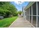 Backyard featuring a screened-in porch, storage shed, and green lawn at 317 Cedarcroft Dr, Mooresville, NC 28115