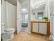 Bathroom with a tub/shower, single sink vanity and view to the nearby bedroom at 317 Cedarcroft Dr, Mooresville, NC 28115