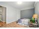 Bright bedroom featuring a single bed, neutral walls and a view of the walk-in closet at 317 Cedarcroft Dr, Mooresville, NC 28115