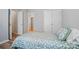 Bedroom with neutral walls, double closets, and decorative floral bedding at 317 Cedarcroft Dr, Mooresville, NC 28115