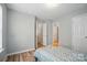 Neutral bedroom showcases multiple closets and doors, enhancing storage at 317 Cedarcroft Dr, Mooresville, NC 28115
