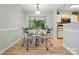 Cozy dining area with views of the backyard and access to the kitchen at 317 Cedarcroft Dr, Mooresville, NC 28115