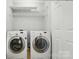 Laundry room features Samsung washer and dryer and wire shelving at 317 Cedarcroft Dr, Mooresville, NC 28115