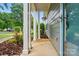 Charming front porch with inviting entryway and manicured landscaping at 317 Cedarcroft Dr, Mooresville, NC 28115