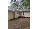 Backyard featuring vinyl siding, a white door with steps, and a tree at 343 Dayvault Sw St, Concord, NC 28025