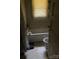 Modest bathroom with tub, toilet, and window featuring blinds at 343 Dayvault Sw St, Concord, NC 28025