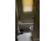 Modest bathroom with tub, toilet, and window featuring blinds at 343 Dayvault Sw St, Concord, NC 28025