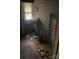 Small bathroom with a pedestal sink and debris scattered around the room at 343 Dayvault Sw St, Concord, NC 28025