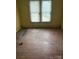 Bedroom showcasing worn hardwood floors and a window with natural light at 343 Dayvault Sw St, Concord, NC 28025