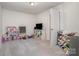 Neutral-toned bedroom with a TV, toy storage, and space for a variety of activities at 3436 Scottish Fern Ln # 172, Indian Land, SC 29707
