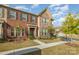 Charming brick townhome showcasing its inviting entrance and well-maintained lawn at 3436 Scottish Fern Ln # 172, Indian Land, SC 29707