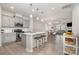 Open-concept kitchen featuring a central island, stainless steel appliances, and light grey cabinets at 3436 Scottish Fern Ln # 172, Indian Land, SC 29707