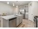 Modern kitchen featuring stainless steel appliances, a large island, gray cabinets, and a gas range at 3436 Scottish Fern Ln # 172, Indian Land, SC 29707