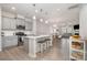 Open-concept kitchen featuring a central island, stainless steel appliances, and light grey cabinets at 3436 Scottish Fern Ln # 172, Indian Land, SC 29707