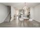Inviting living area featuring modern furnishings, a bright kitchen, and staircase to a second level at 3436 Scottish Fern Ln # 172, Indian Land, SC 29707