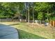 Spacious backyard with mature trees, grassy area, and privacy fence, perfect for outdoor enjoyment at 3505 Frostmoor Pl, Charlotte, NC 28269