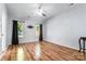Light and airy bedroom featuring sleek hardwood floors and contemporary ceiling fan at 3505 Frostmoor Pl, Charlotte, NC 28269