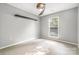 Light-filled bedroom with plush carpeting, modern ceiling fan, and ample natural light at 3505 Frostmoor Pl, Charlotte, NC 28269