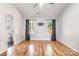 Bedroom with wood flooring, neutral walls, and two windows with curtains at 3505 Frostmoor Pl, Charlotte, NC 28269
