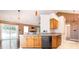 Open-concept kitchen with granite countertops and stainless steel dishwasher at 3505 Frostmoor Pl, Charlotte, NC 28269