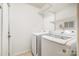 Bright laundry room with newer model washer and dryer and wire shelving at 3505 Frostmoor Pl, Charlotte, NC 28269