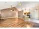 Bright living room with hardwood floors and bar top overlooking the kitchen at 3505 Frostmoor Pl, Charlotte, NC 28269