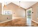 Bright living room with hardwood floors and sliding glass doors to the backyard at 3505 Frostmoor Pl, Charlotte, NC 28269