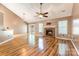 Bright living room with hardwood floors and gas fireplace at 3505 Frostmoor Pl, Charlotte, NC 28269