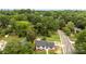An aerial view of a lovely home featuring an expansive yard and tree-lined street at 3661 Annlin Ave, Charlotte, NC 28209