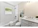 Bright bathroom featuring a tub, shower, and white vanity with a marble countertop at 3661 Annlin Ave, Charlotte, NC 28209