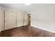 Bedroom with hardwood floors and a double closet at 3661 Annlin Ave, Charlotte, NC 28209