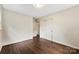 Bedroom with hardwood floors, closet, and bathroom access at 3661 Annlin Ave, Charlotte, NC 28209