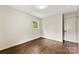 Empty bedroom with hardwood floors, natural light, and neutral walls at 3661 Annlin Ave, Charlotte, NC 28209