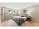 Bright bedroom with two windows and hardwood floors at 3661 Annlin Ave, Charlotte, NC 28209