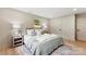 Light filled bedroom with hardwood floors and ensuite bathroom at 3661 Annlin Ave, Charlotte, NC 28209